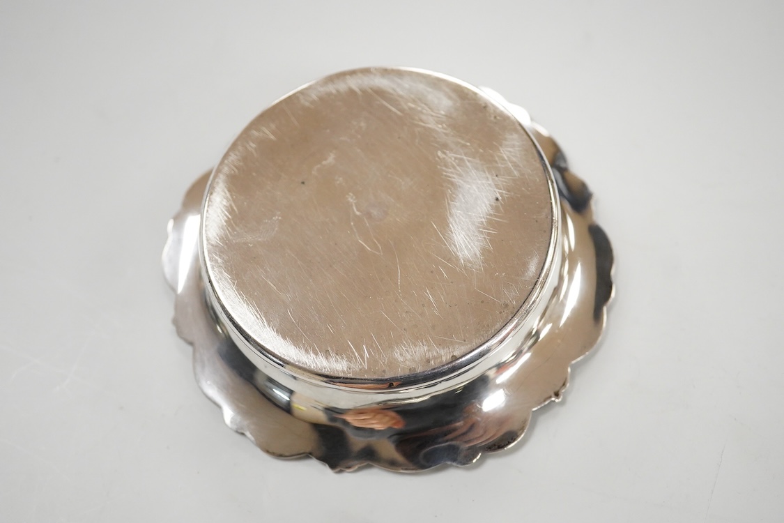 A George V silver pedestal bon bon dish, Sheffield, 1921, diameter 13.2cm, one other earlier silver dish by Josiah Williams & Co, London, 1904 and a silver cigarette case. and a cigarette case, gross 11.5oz.